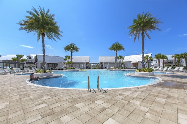 view of swimming pool featuring a patio area and pool water feature