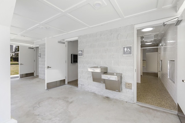 bathroom featuring concrete flooring