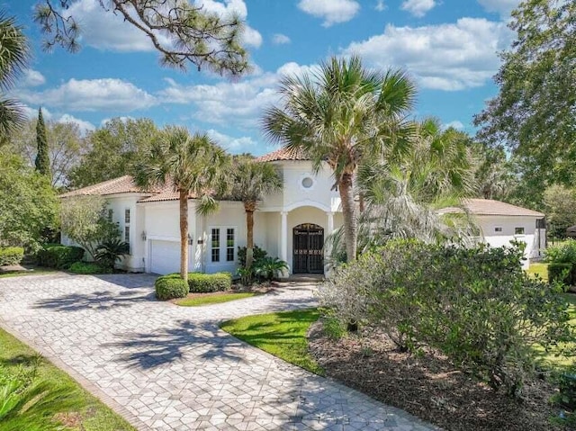 mediterranean / spanish-style house featuring french doors