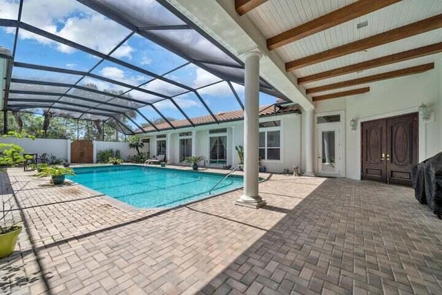 view of pool with a lanai and a patio area