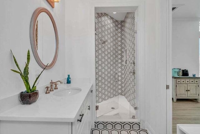 bathroom featuring vanity and a shower