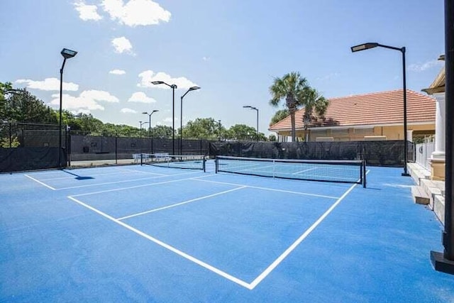 view of tennis court featuring basketball court