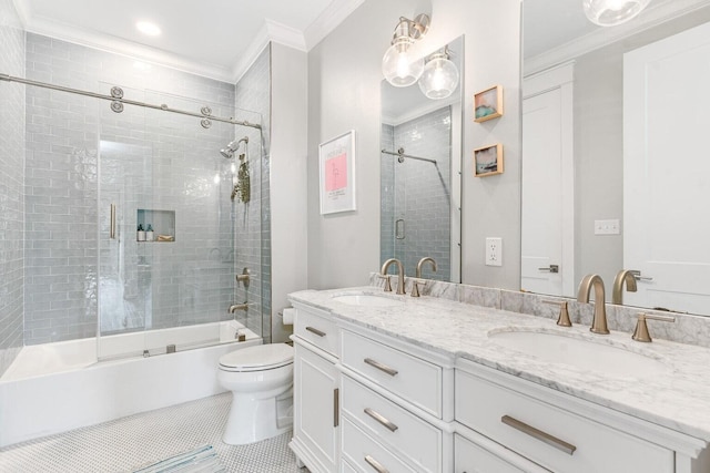 full bathroom with tile patterned floors, bath / shower combo with glass door, toilet, vanity, and ornamental molding