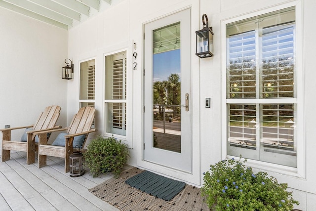 view of exterior entry with a porch