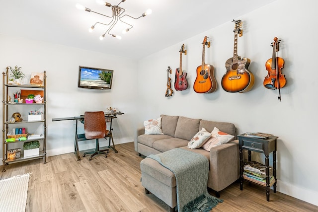 living room featuring light hardwood / wood-style floors and an inviting chandelier