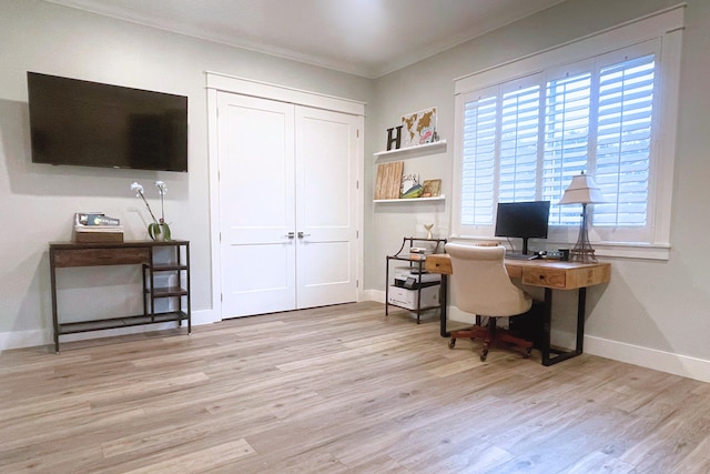 office space with crown molding and light wood-type flooring