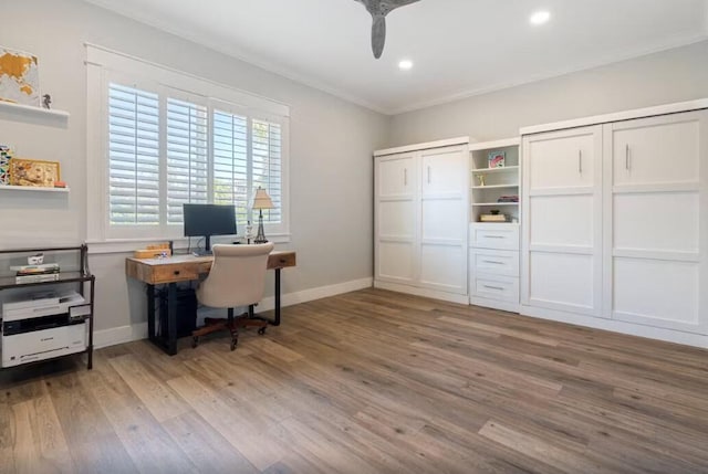 office area with ceiling fan, wood-type flooring, and ornamental molding