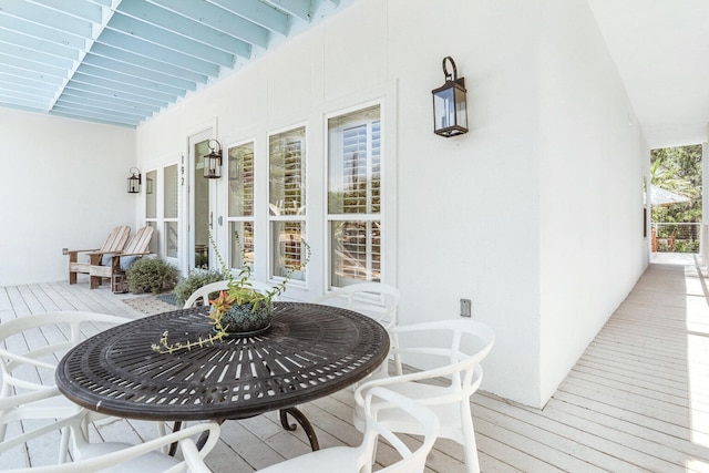 wooden terrace featuring covered porch