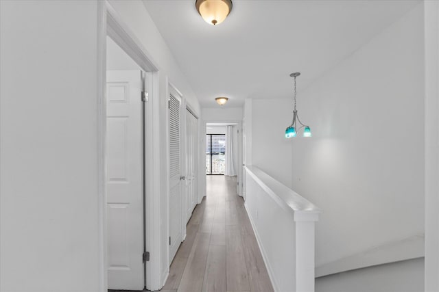 corridor featuring light hardwood / wood-style flooring