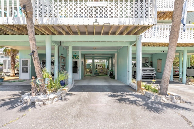 view of exterior entry with a carport