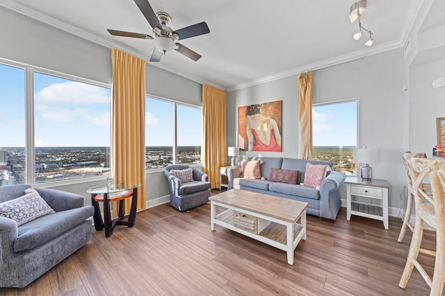 living room with ceiling fan, wood-type flooring, and crown molding