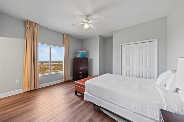 bedroom featuring a closet, ceiling fan, and hardwood / wood-style flooring