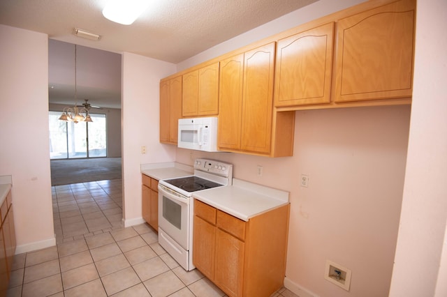 kitchen featuring light tile patterned floors, white appliances, decorative light fixtures, and ceiling fan