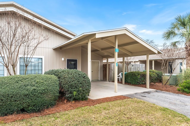 doorway to property with a carport