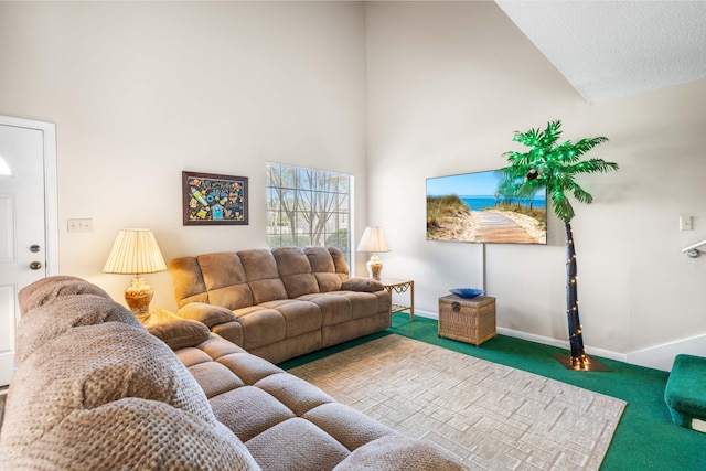 carpeted living room featuring high vaulted ceiling and a textured ceiling