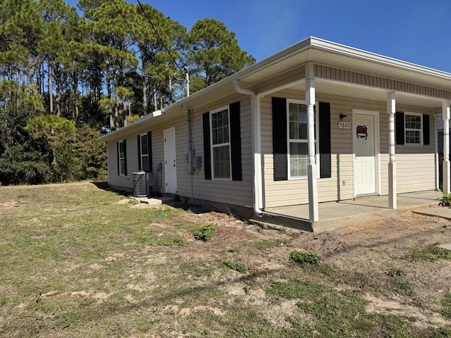 view of front of house with central AC and covered porch