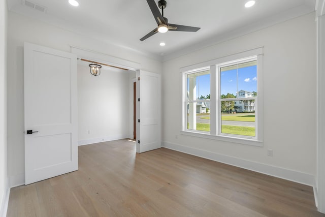 spare room with ceiling fan and light hardwood / wood-style flooring