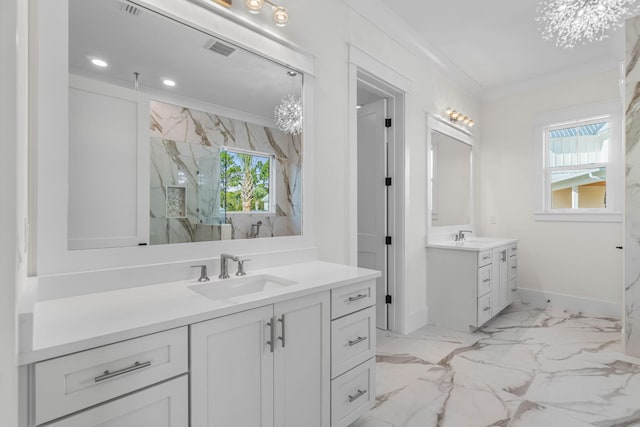 bathroom with crown molding and vanity