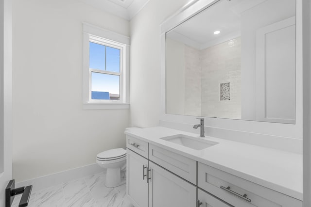 bathroom with vanity, toilet, walk in shower, and ornamental molding