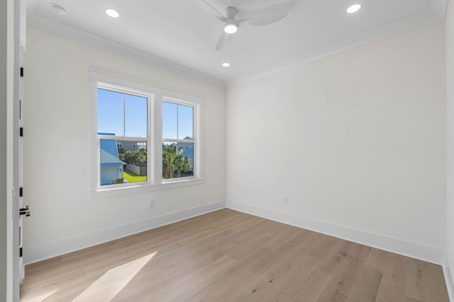 spare room featuring ceiling fan, light hardwood / wood-style floors, and ornamental molding