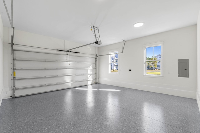 garage with electric panel and a garage door opener