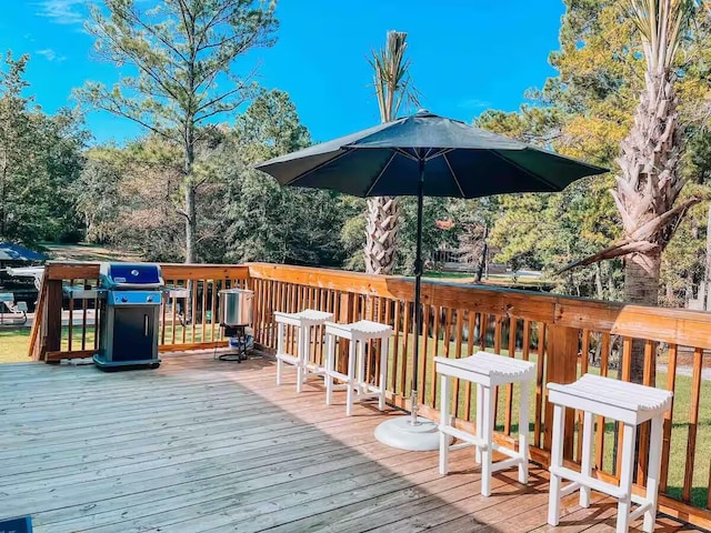 wooden deck featuring grilling area