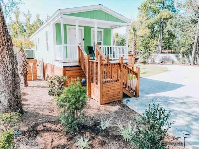 view of play area with a porch and central AC