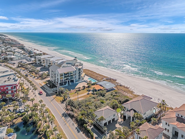 drone / aerial view featuring a water view and a beach view