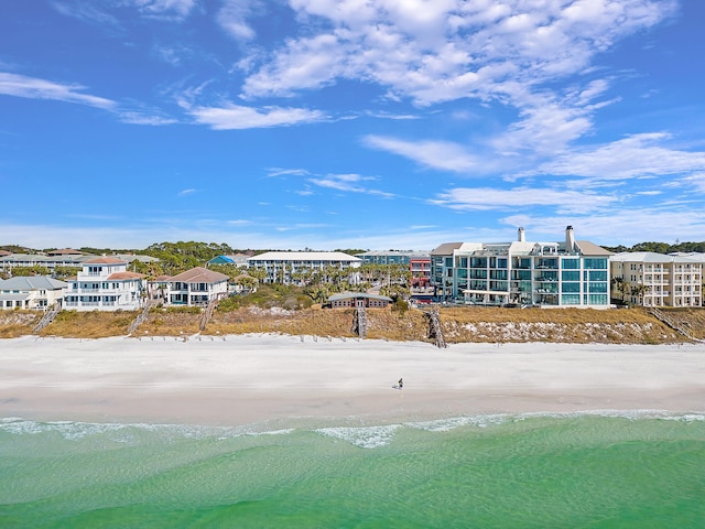 aerial view with a water view and a view of the beach