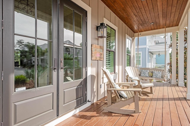 unfurnished sunroom with wooden ceiling