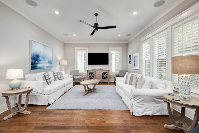 living room featuring ceiling fan, dark hardwood / wood-style floors, and ornamental molding