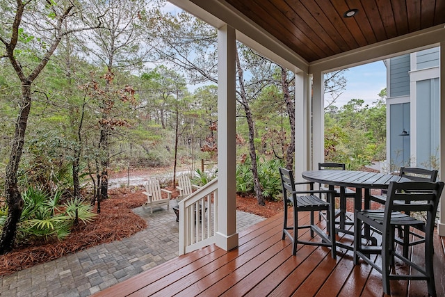 sunroom featuring wooden ceiling