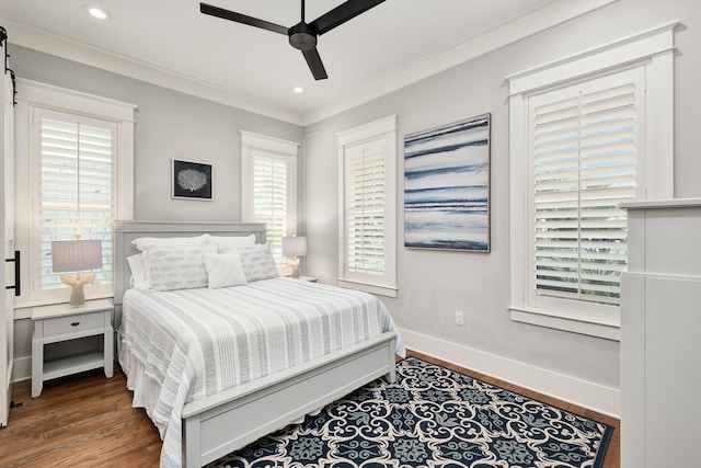 bedroom featuring ceiling fan, ornamental molding, and dark wood-type flooring