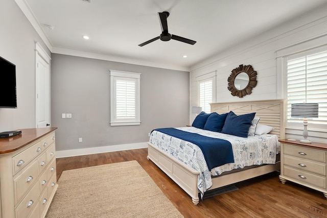 bedroom with multiple windows, dark hardwood / wood-style flooring, ceiling fan, and ornamental molding