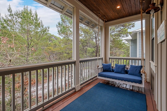 sunroom with wood ceiling