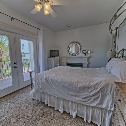 carpeted bedroom with ceiling fan, access to exterior, and french doors