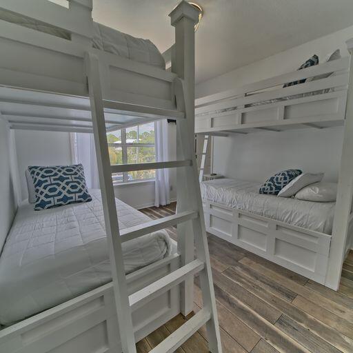 bedroom with dark wood-type flooring