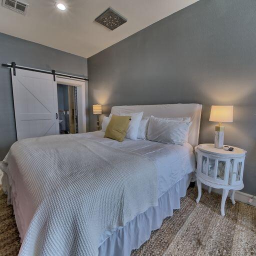 bedroom with a barn door