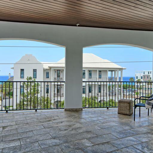 view of patio / terrace featuring a balcony and a water view