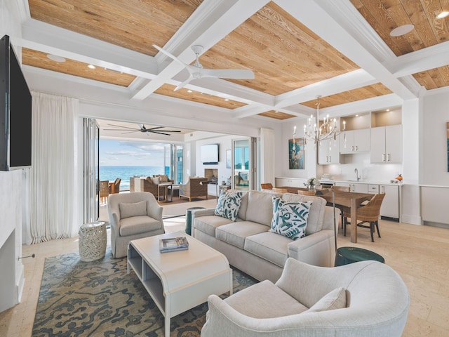 living room featuring ceiling fan with notable chandelier, sink, ornamental molding, coffered ceiling, and beam ceiling