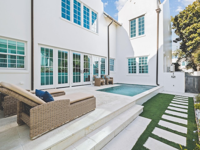 back of property featuring a patio area and french doors