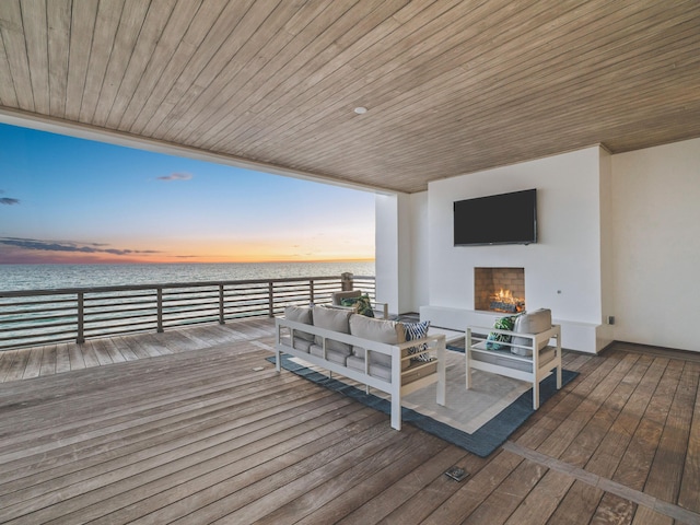 wooden terrace with outdoor lounge area