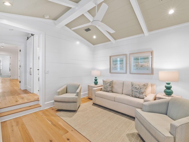 living room with lofted ceiling with beams, hardwood / wood-style flooring, and ceiling fan