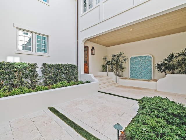 entrance to property featuring a patio