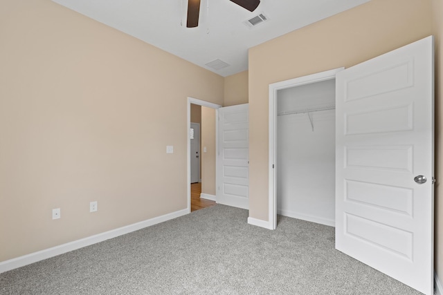 unfurnished bedroom with ceiling fan, a closet, and carpet floors