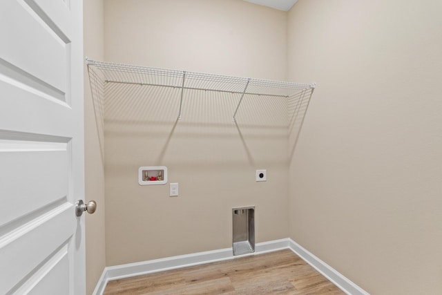 laundry area featuring hardwood / wood-style flooring, washer hookup, and electric dryer hookup