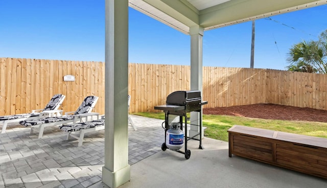 view of patio featuring a grill