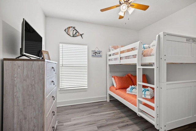 bedroom with ceiling fan and hardwood / wood-style floors