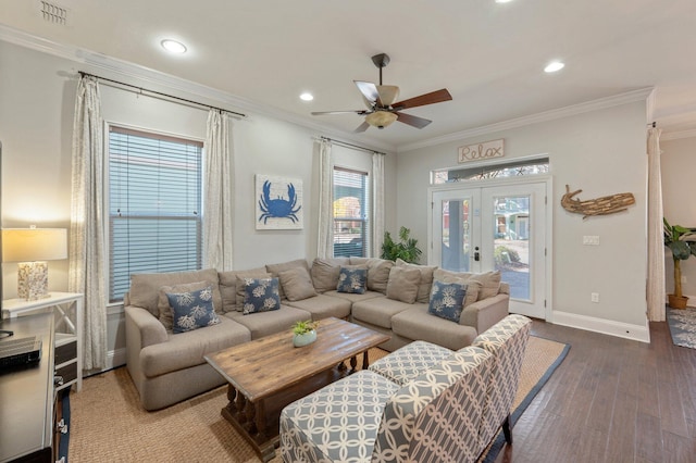 living room featuring hardwood / wood-style flooring, ceiling fan, ornamental molding, and french doors