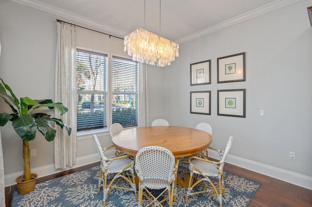 dining area with plenty of natural light, dark hardwood / wood-style flooring, crown molding, and a chandelier